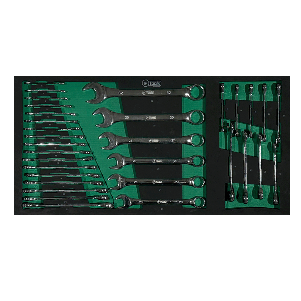 Full size range of FTools combination wrenches from 6 to 32 mm alongside a set of ratchet combination wrenches in a green EVA foam tray.