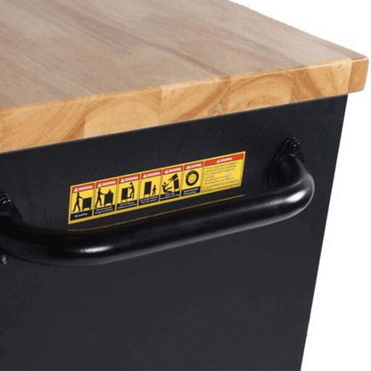 Jungwille Hockenheim tool cabinet detail showing the black steel side handle beneath the solid wood worktop.
