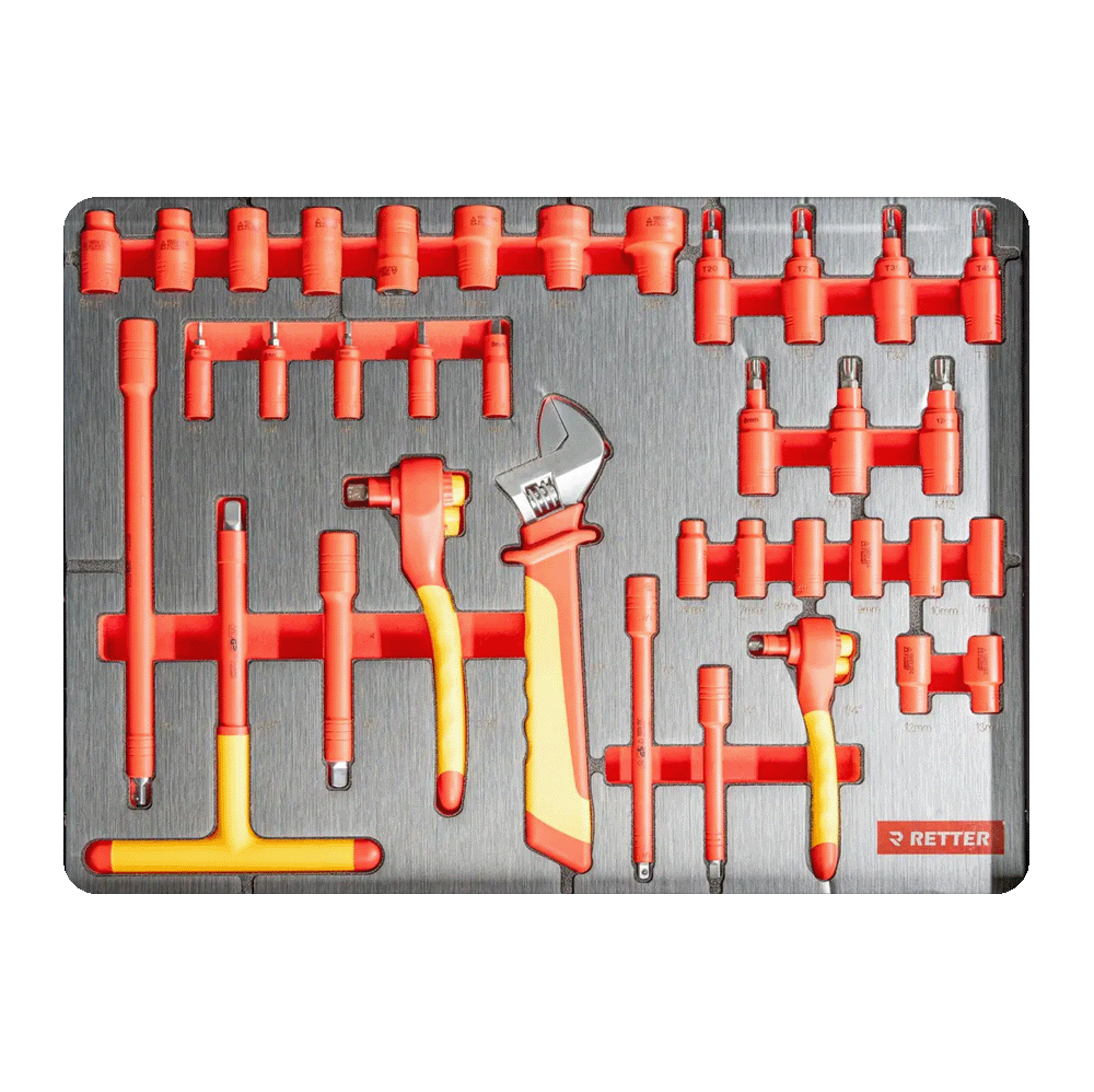 Insulated T-handle keys, VDE adjustable wrench, insulated sockets, and extensions inside a workshop drawer insert.