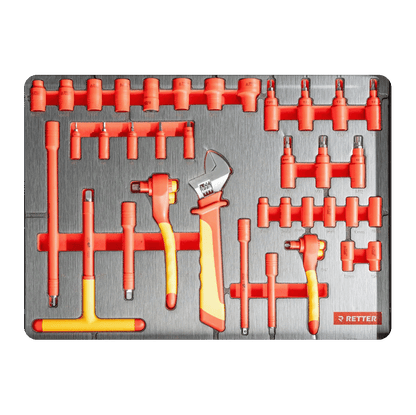 Insulated T-handle keys, VDE adjustable wrench, insulated sockets, and extensions inside a workshop drawer insert.