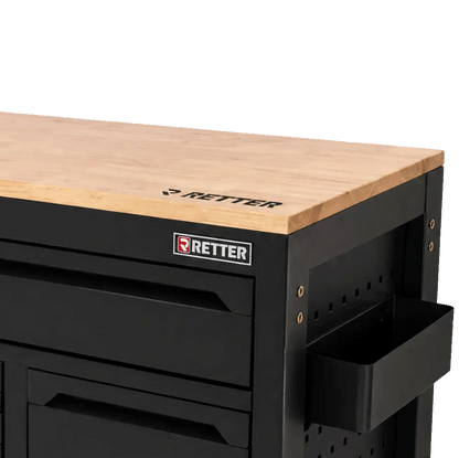 Retter R23 tool cabinet detail showing the durable solid wood worktop surface and a side-mounted utility storage bin.